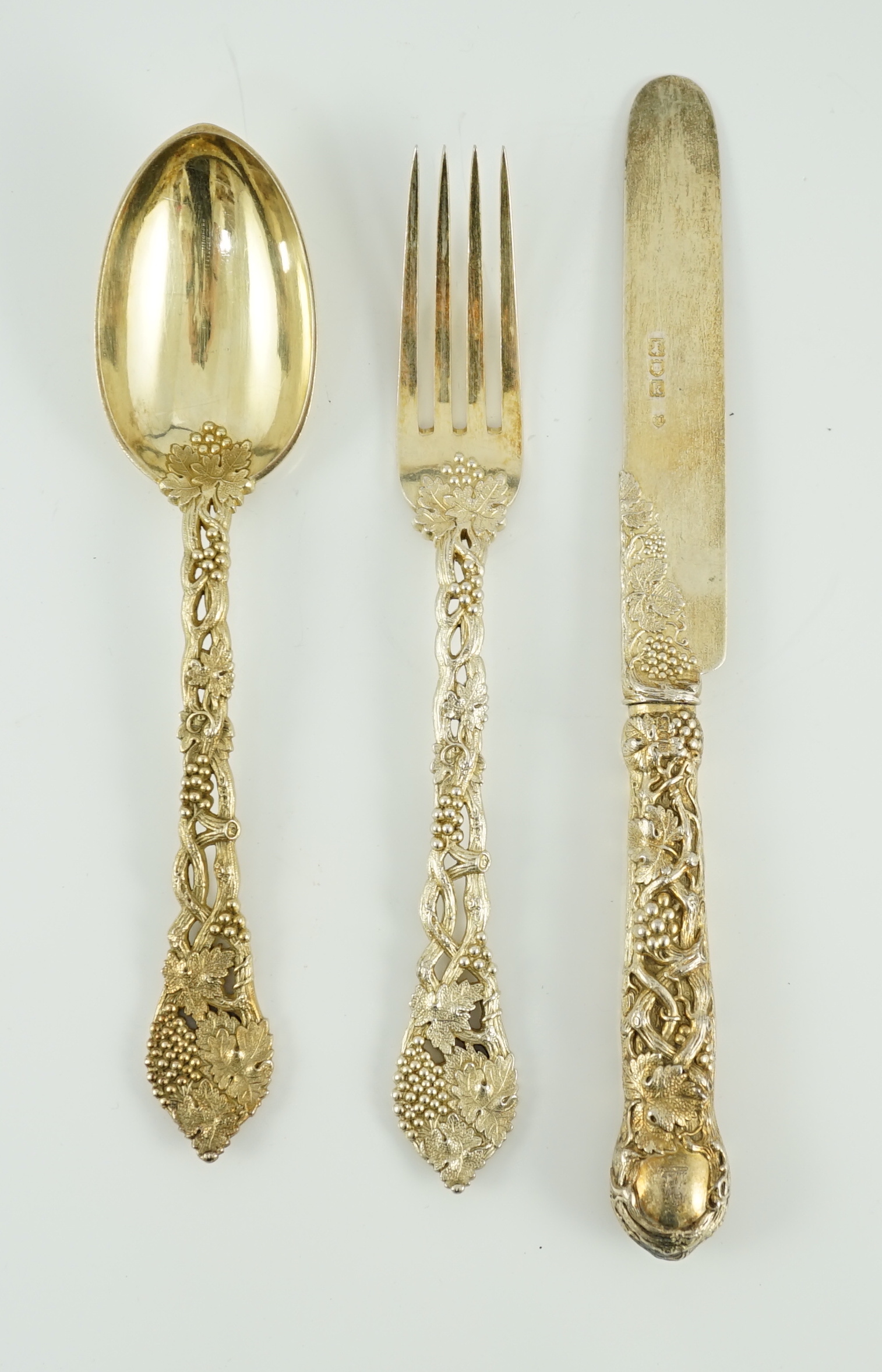 A Victorian and later matched silver gilt part canteen of dessert cutlery by Francis Higgins II & III